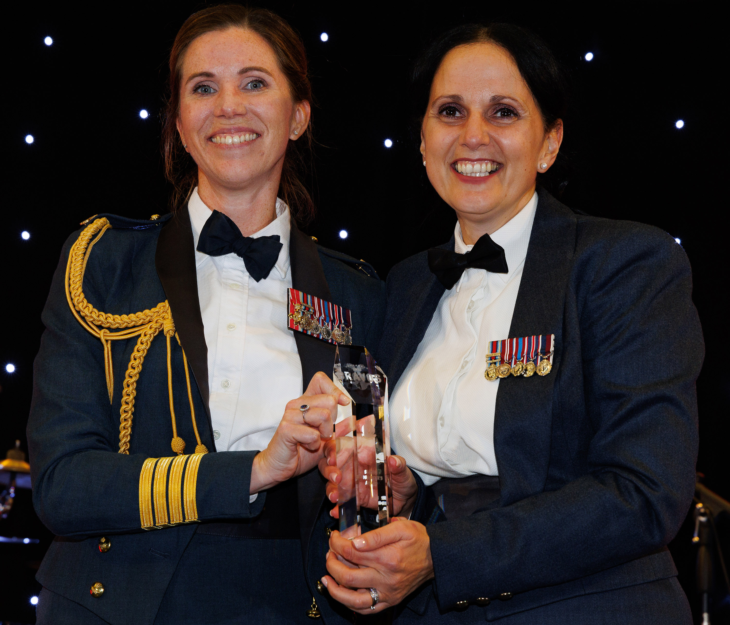 Photo: Image shows Warrant Officer Rezazadeh-Wilson receiving the Station Commander’s Award